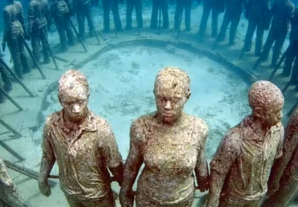 An eerie ring of statues in Grenada’s Molinere Underwater Sculpture Park. Photo: Orlando K. Romain.