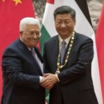 Palestinian President Mahmoud Abbas, left, shakes hands after presenting a medallion to Chinese President Xi Jinping; July 18, 2017. Photo: Reuters/Mark Schiefelbein/Pool.