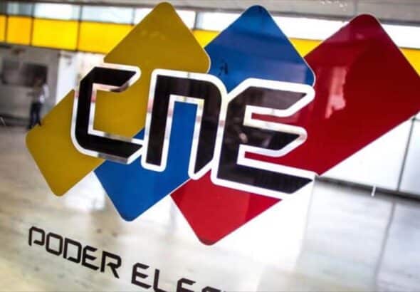 A CNE logo on a glass window. Photo: Venezuela Analysis.