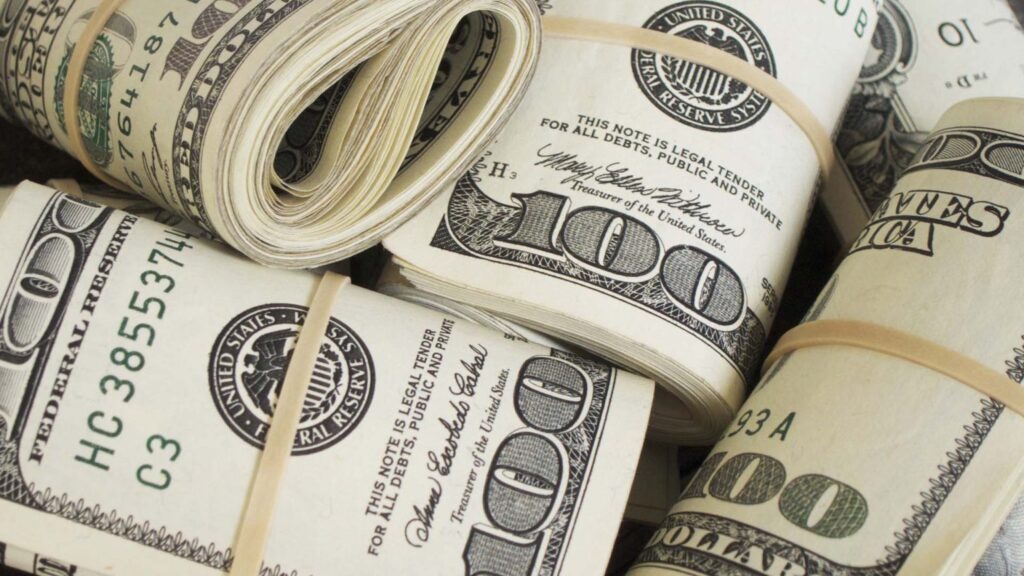 dollar-100-bills-rolls-1536x864