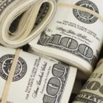 dollar-100-bills-rolls-1536x864