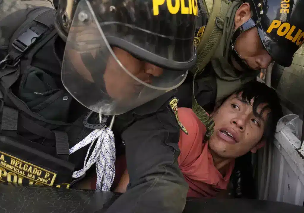 Protester arrested during the January Takeover of Lima, Peru. Photo: AP.