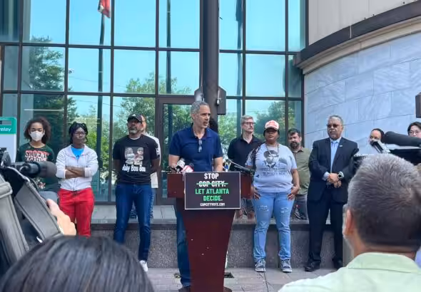 Kamau Franklin of Community Movement Builders and other organizers announce a ballot referendum effort at a June 7 press conference in Atlanta. Photo: Twitter @Micahinatl.