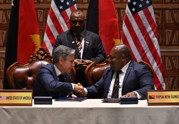 Officials from the US and Papua New Guinea sign a cooperation agreement. Photo: Misión Verdad.