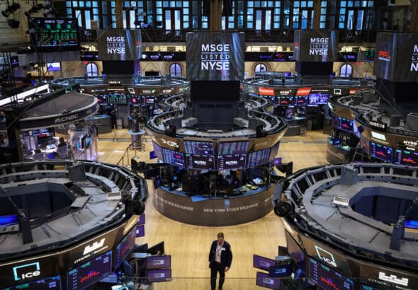Aerial view of a trader walking through the trading floor at the New York Stock Exchange (NYSE). Photo: Andrew Kelly/Reuters.