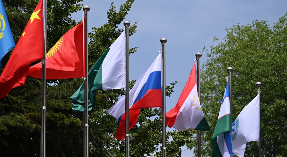 Flags flutter at the headquarters of the Shanghai Cooperation Organisation in Beijing on July 4, 2023. Photo: PressTV.