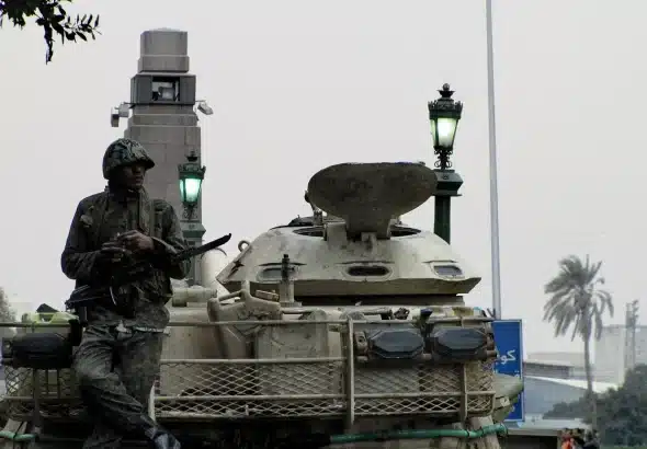 An Egyptian soldier stands atop a tank in Tahrir. Photo: Wikimedia Commons.