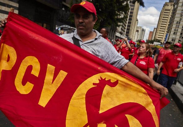Communist Party of Venezuela (PCV) supporter marching at a government demonstration in support of the Bolivarian Revolution a few years ago. Photo: Cristian Hernandez/Cronica Uno/FIle photo.