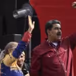 Venezuela's President Nicolas Maduro (Right) and his wife Cilia Flores (Left) at a rally in Caracas, April 13, 2023. Photo: Yuri Cortez/AFP.