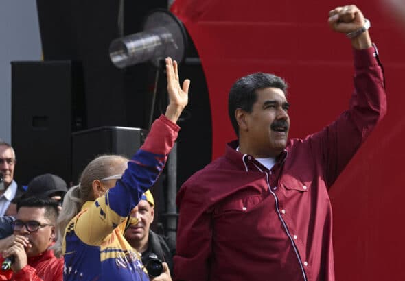Venezuela's President Nicolas Maduro (Right) and his wife Cilia Flores (Left) at a rally in Caracas, April 13, 2023. Photo: Yuri Cortez/AFP.