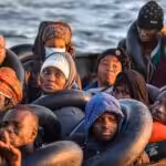 Migrants from sub-Saharan Africa, pictured on October 4, 2022, sit in a makeshift boat as they travel towards the Italian coast. Photo: Black Agenda Report/File photo.