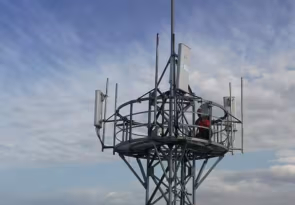 Equipment being installed atop a 5G base station in northwest China’s Xinjiang region. Photo: Xinhua