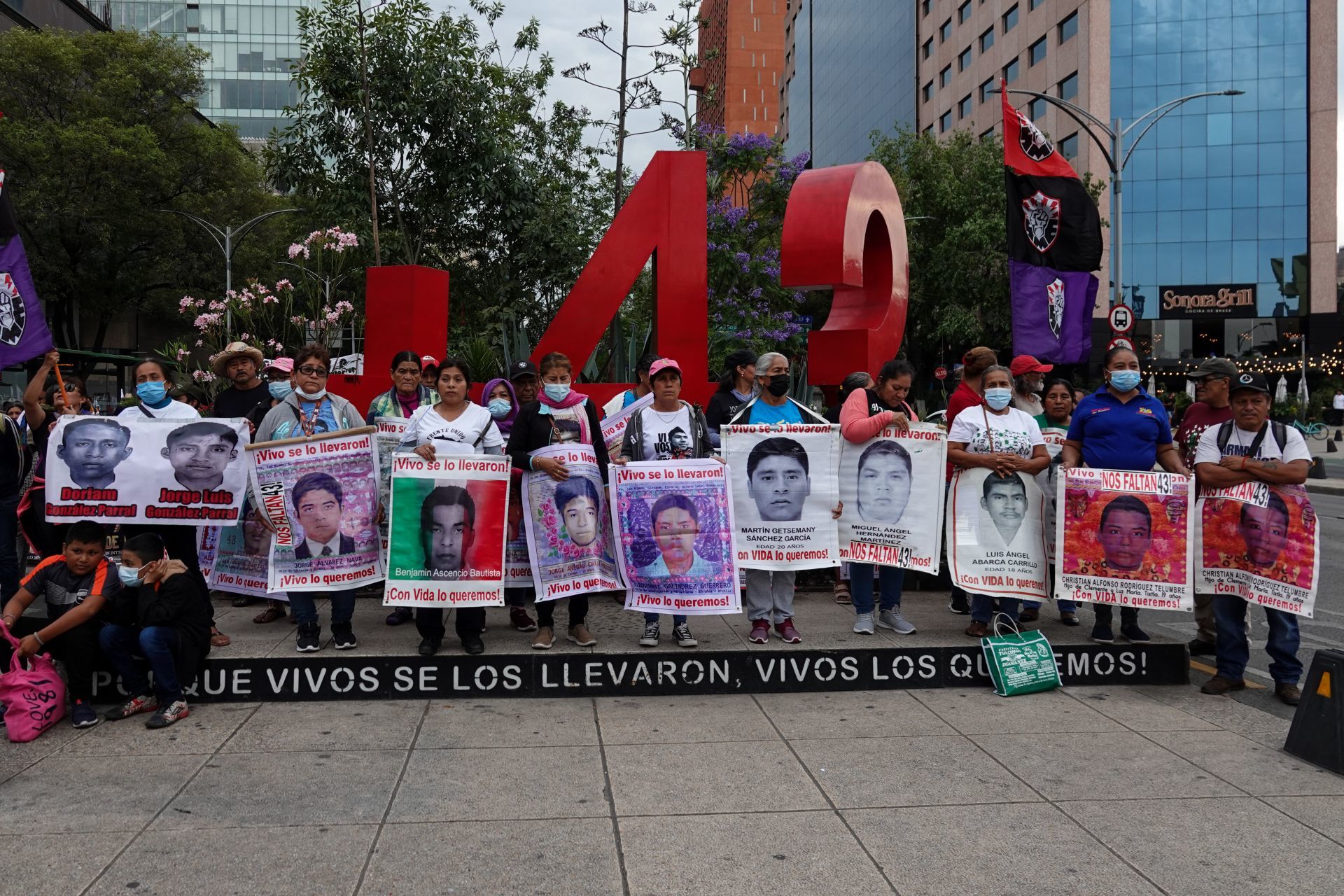 Family members and friends of the 43 disappeared students of Ayotzinapa marching to demand justice with their photos at the Angel of Independence monument in Mexico City, May 26, 2023. Photo: Galo Cañas/Cuartoscuro.