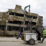 Pedestrians walk past the remains of the former Chinese Embassy in Belgrade, on November 10, 2010. In 1999, the Chinese embassy in Belgrade, was hit and set on fire during NATO airstrikes on the city. Photo: AFP 2023/Andrej Isakovic.