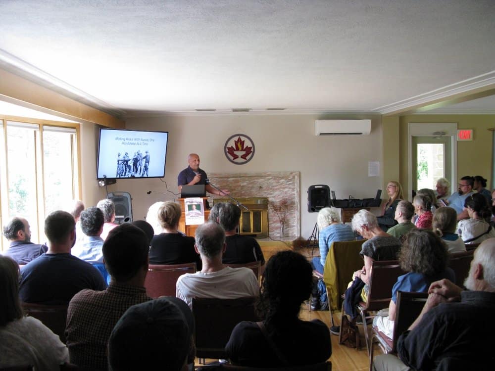 Canadian politician and activist Dimitri Lascaris speaking at the Fredericton stop of his cross-Canada peace tour, which ended on July 8, 2023. Photo: Twitter/@dimitrilascaris.
