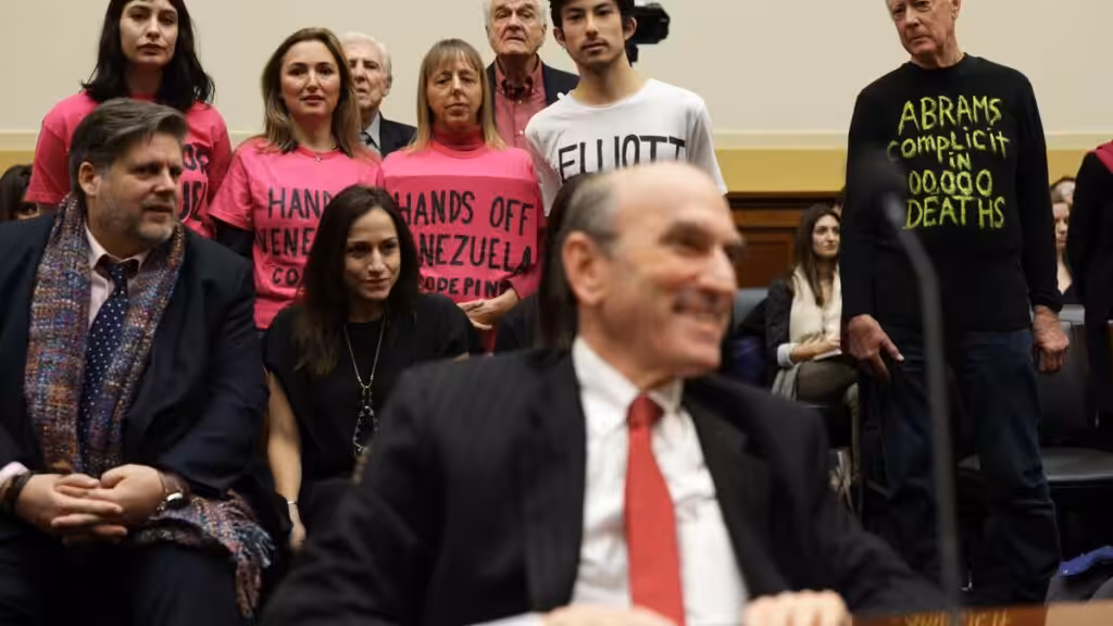 CODEPINK activists (from left to right) Caroline Debnam, Ariel Gold, Medea Benjamin, Kei Pritsker, and David Barrows stage a protest on a hearing for US Special Envoy for Venezuela Elliott Abrams before the US Congress on February 13, 2019. Photo: Alex Wong/Getty Images.