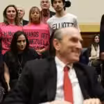 CODEPINK activists (from left to right) Caroline Debnam, Ariel Gold, Medea Benjamin, Kei Pritsker, and David Barrows stage a protest on a hearing for US Special Envoy for Venezuela Elliott Abrams before the US Congress on February 13, 2019. Photo: Alex Wong/Getty Images.