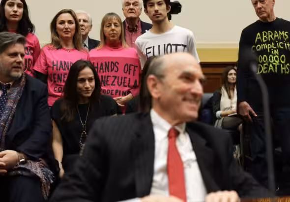 CODEPINK activists (from left to right) Caroline Debnam, Ariel Gold, Medea Benjamin, Kei Pritsker, and David Barrows stage a protest on a hearing for US Special Envoy for Venezuela Elliott Abrams before the US Congress on February 13, 2019. Photo: Alex Wong/Getty Images.