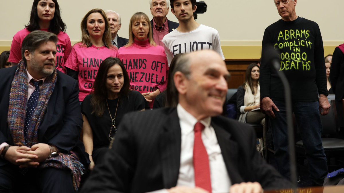 CODEPINK activists (from left to right) Caroline Debnam, Ariel Gold, Medea Benjamin, Kei Pritsker, and David Barrows stage a protest on a hearing for US Special Envoy for Venezuela Elliott Abrams before the US Congress on February 13, 2019. Photo: Alex Wong/Getty Images.