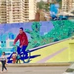 Mural in Caracas showing President Hugo Chávez riding a bike. Photo: Twitter/@adriennepine.