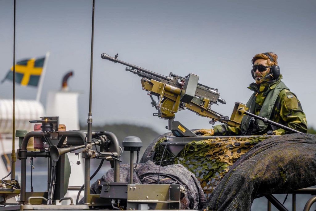 A Swedish soldier on top on an armored military vehicle in what seems to be a military drill. Photo: Getty Images