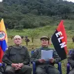 ELN commanders sat next to an ELN flag, making statements in 2018. Photo: ELN.