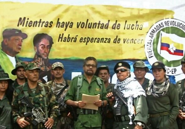 FARC dissident group Segunda Marquetalia commander Iván Márquez (center, in olive uniform), with legendary FARC guerrilla leader Jesús Santrich (wearing a kuffiyeh) to his left, from a video published in August 2019. Photo: YouTube.