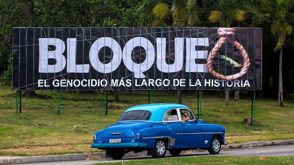 A billboard on a Havana highway denounces 60 years of the criminal US  blockade with the following caption next to a hanging rope: "blockade: the longest genocide in history." Photo: AP/File photo.