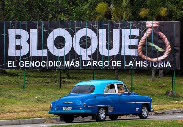 A billboard on a Havana highway denounces 60 years of the criminal US  blockade with the following caption next to a hanging rope: "blockade: the longest genocide in history." Photo: AP/File photo.