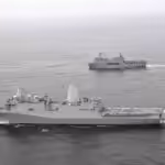 The amphibious transport dock ship USS John P. Murtha (foreground) and Peruvian navy Makassar-class landing platform dock ship BAP Pisco (background) conduct tactical maneuvers and naval formations during a training exercise in the Pacific Ocean. Photo: James Ho/US Navy/Wikimedia Commons.
