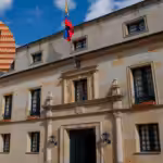 Photo composition with a portrait of Ambassador Milton Rengifo with the Colombian Ministry of Foreign Affairs headquarters in the background. Photo: Orinoco Tribune.