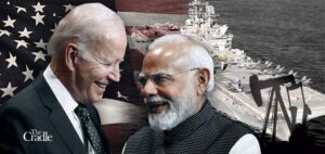 Photo composition, President Joe Biden (left), Prime Minister Narendra Modi (right) and in the background the US flag and a US Naval ship. Photo: The Cradle.