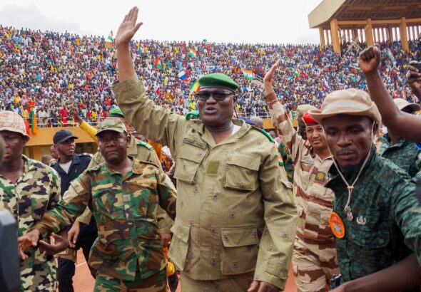 Mohamed Toumba, one of the leading figures in Niger's military government, at a massive rally with supporters. Photo: Balima Boreima/Anadolu Agency via Getty Images.