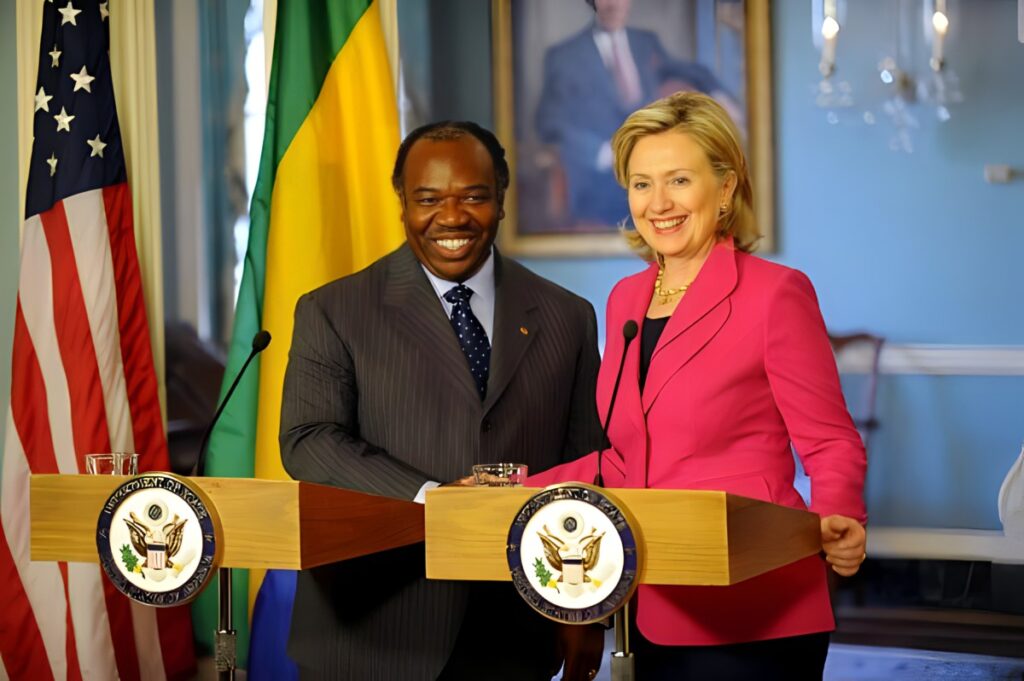Deposed president of Gabon Ali Bongo shakes hand with then US Secretary of State Hillary Clinton in 2010. File photo.