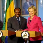 Deposed president of Gabon Ali Bongo shakes hand with then US Secretary of State Hillary Clinton in 2010. File photo.
