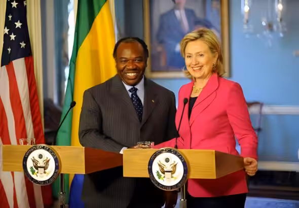 Deposed president of Gabon Ali Bongo shakes hand with then US Secretary of State Hillary Clinton in 2010. File photo.