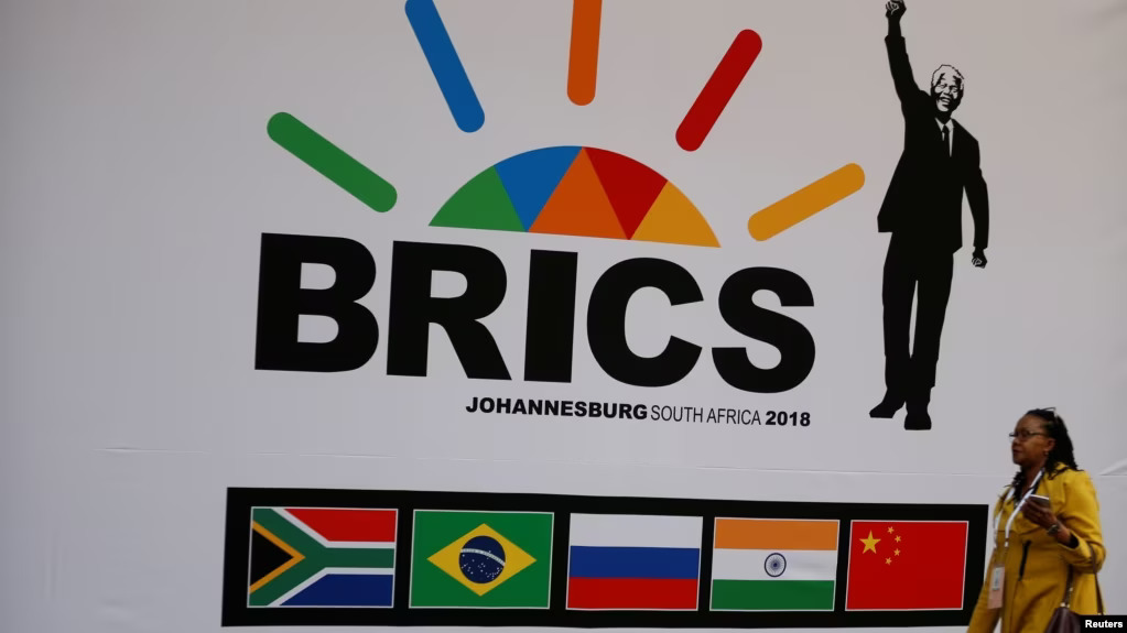 A delegate walks past a BRICS logo ahead of the 10th BRICS Summit, in Sandton, South Africa, July 24, 2018. Photo: Reuters.