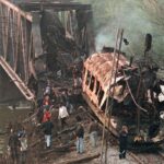 The smoldering wreckage of a passenger train after being hit by two missiles launched from a NATO F-15. At least 55 commuters were killed. Photo: Struggle La Lucha/File photo.