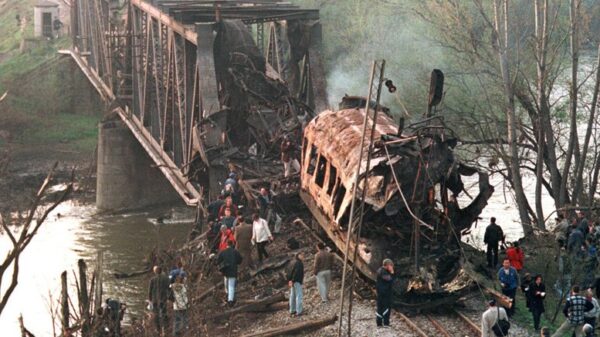 The smoldering wreckage of a passenger train after being hit by two missiles launched from a NATO F-15. At least 55 commuters were killed. Photo: Struggle La Lucha/File photo.