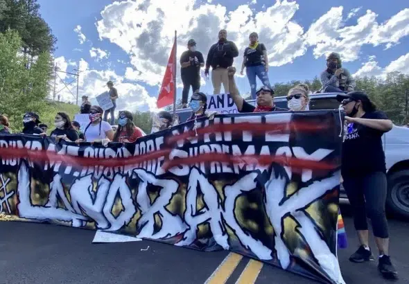 Indigenous Land Defenders blocking the road to Mount Rushmore on Friday, July 3, 2020. Photo: Willi White.