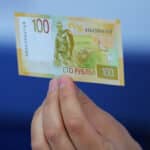 Hand holding a Russian Ruble bill. Photo: Reuters.