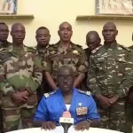 Niger Army spokesman Colonel Major Amadou Adramane speaks during an appearance on national television, after President Mohamed Bazoum was held in the presidential palace, in Niamey, Niger, July 26, 2023 in this still image taken from video. Photo: ORTN/via Reuters TV/Handout via Reuters.