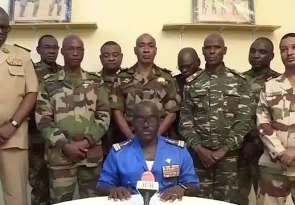 Niger Army spokesman Colonel Major Amadou Adramane speaks during an appearance on national television, after President Mohamed Bazoum was held in the presidential palace, in Niamey, Niger, July 26, 2023 in this still image taken from video. Photo: ORTN/via Reuters TV/Handout via Reuters.
