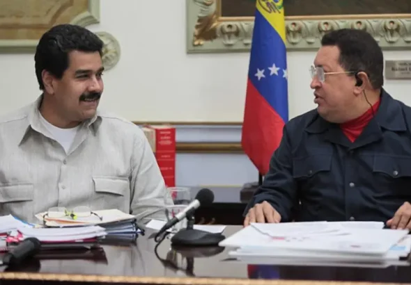 President Nicolás Maduro and Hugo Chávez. Photo: Peoples Dispatch/File photo.