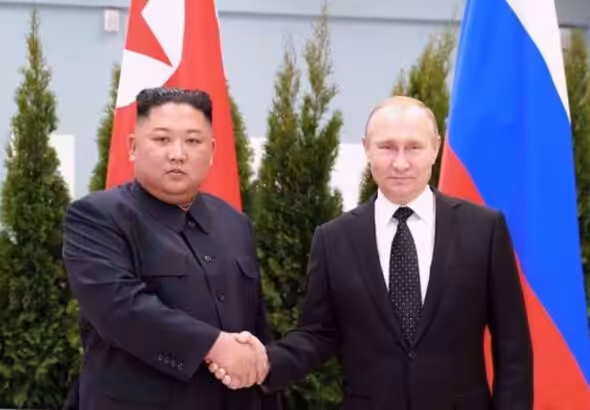 North Korean leader Kim Jong Un shakes hands with Russian President Vladimir Putin in Vladivostok, Russia, in this undated photo released on April 25, 2019 . Photo: North Korea's Central News Agency (KCNA)/Reuters.