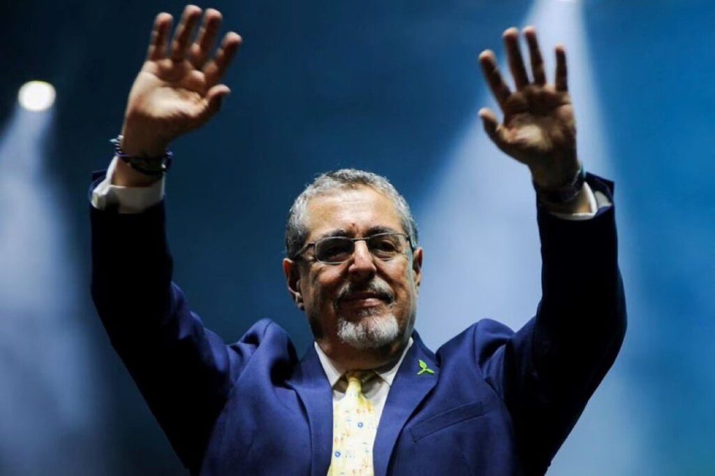Guatemalan President-elect Bernardo Arévalo raising his hands at a political rally. Photo: Cristina Chiquin/Reuters/File photo.