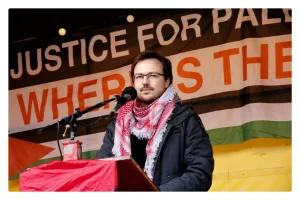 Thomas Hofland of Samidoun NL delivering the speech at the 2021 Nakba rally for which he was targeted by Zionists. Photo: Samidoun.