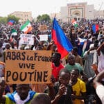 Protesters in favor of the military junta, some holding anti-France, pro-Russia signs, in Niamey, Niger, 3 August 2023. Photo: Sam Mednick/AP Photo.