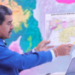 Venezuelan President Nicolas Maduro pointing at the Essequibo territory on an old map of Venezuela during his program Con Maduro+. Photo: Presidential Press.