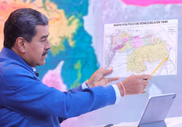 Venezuelan President Nicolas Maduro pointing at the Essequibo territory on an old map of Venezuela during his program Con Maduro+. Photo: Presidential Press.